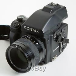Contax 645 Medium Format Camera kit with 80mm lens, film back, strap, and manual