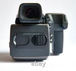 This Hasselblad H1 with Prism, 120 Film Back n Polaroid Back is in new condition